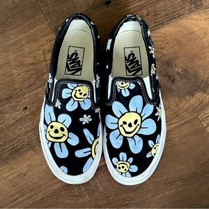 6.5 women’s slip on Vans. Flower smiley face design.